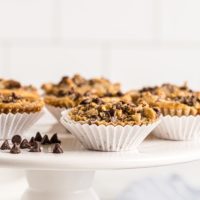 Chocolate chip cupcakes on cake stand with chocolate chips