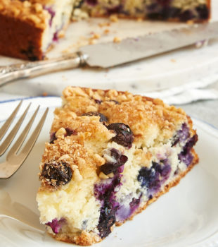 slice of Blueberry Coffee Cake on a blue-rimmed white plate