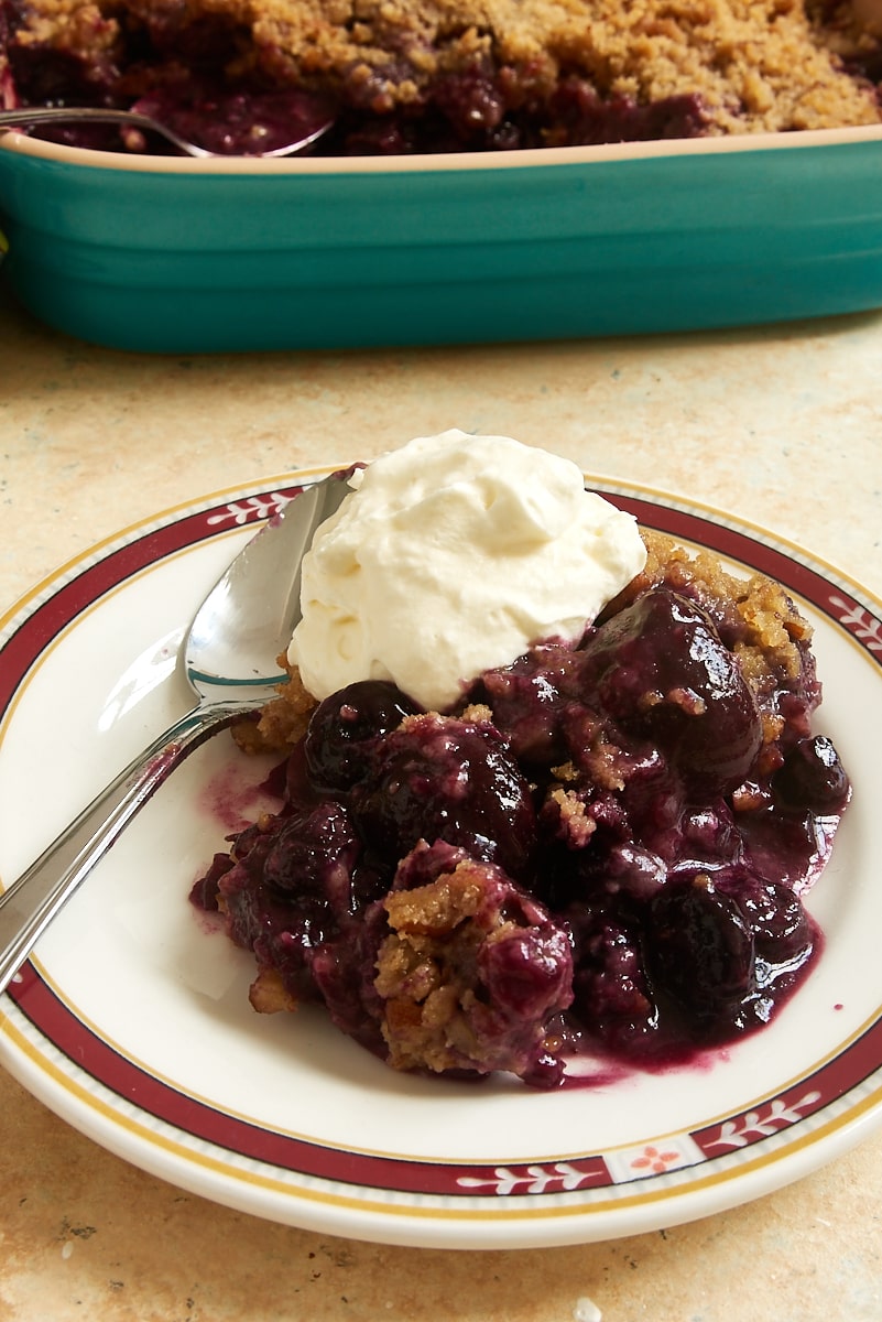 serving of Cherry Berry Crumble topped with sweetened whipped cream