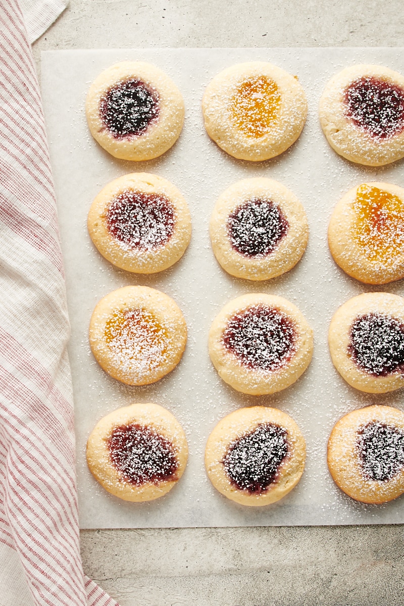 overhead view of Cream Cheese Thumbprint Cookies dusted with confectioners' sugar