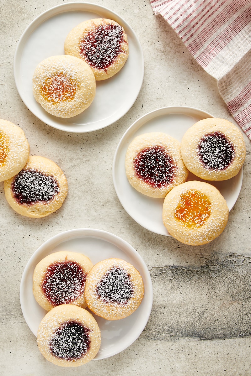 overhead view of Cream Cheese Thumbprint Cookies on white plates