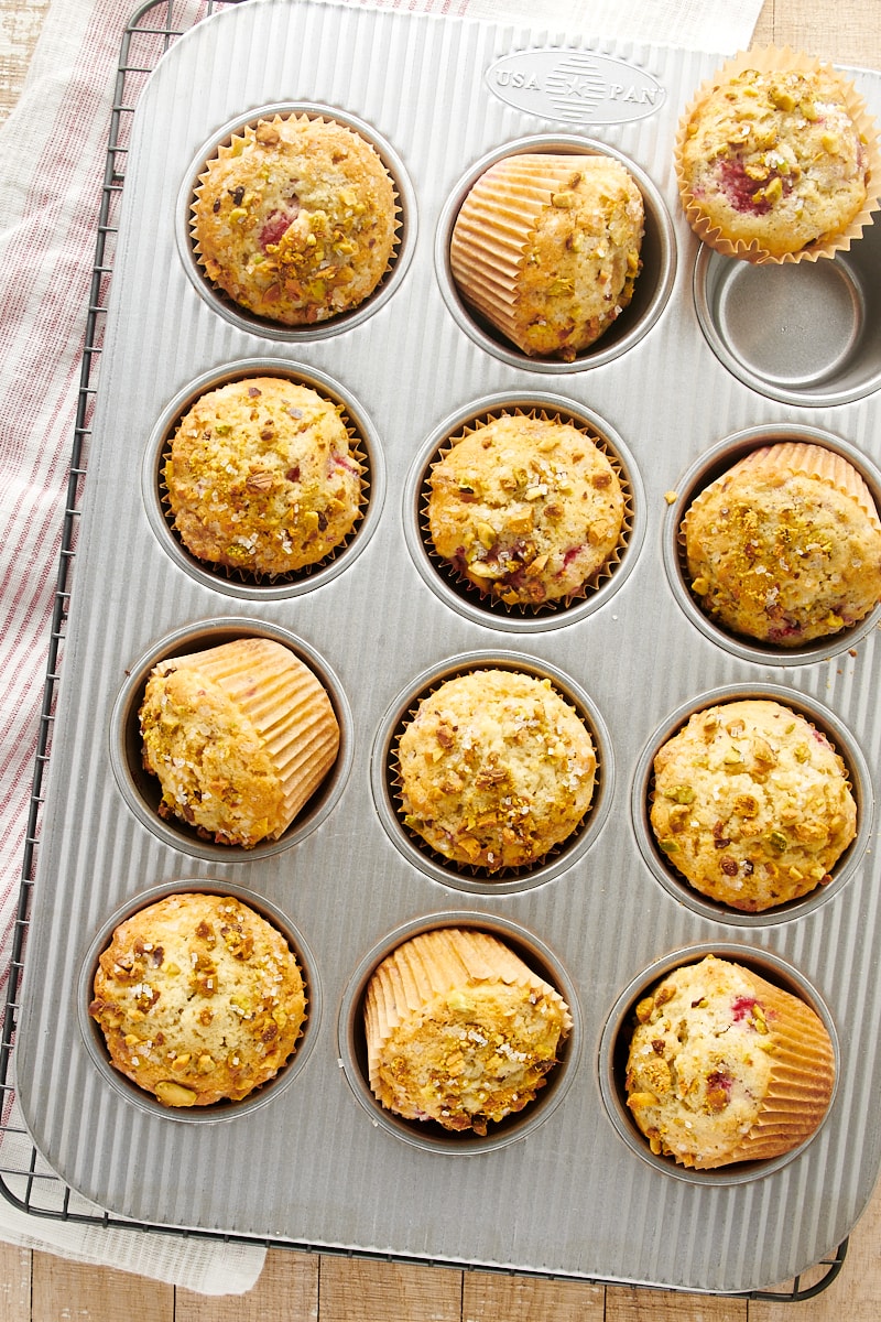 overhead view of freshly baked Raspberry Pistachio Muffins in a muffin pan
