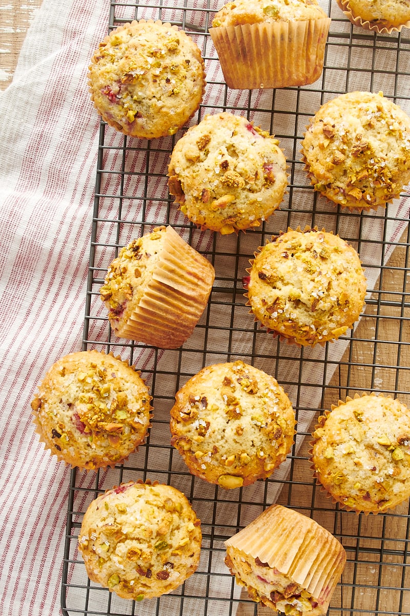 overhead view of Raspberry Pistachio Muffins on a wire rack