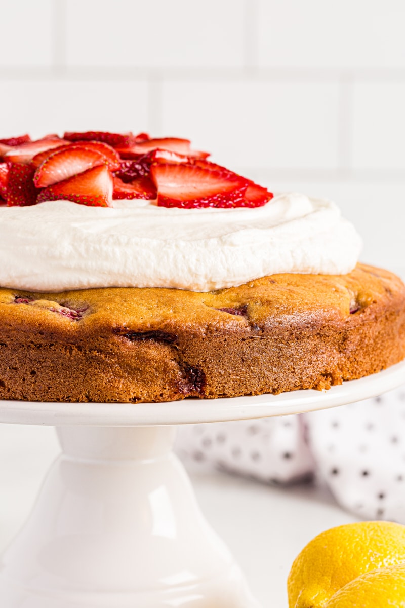 Side view of Lemon-Strawberry Shortcake on cake stand