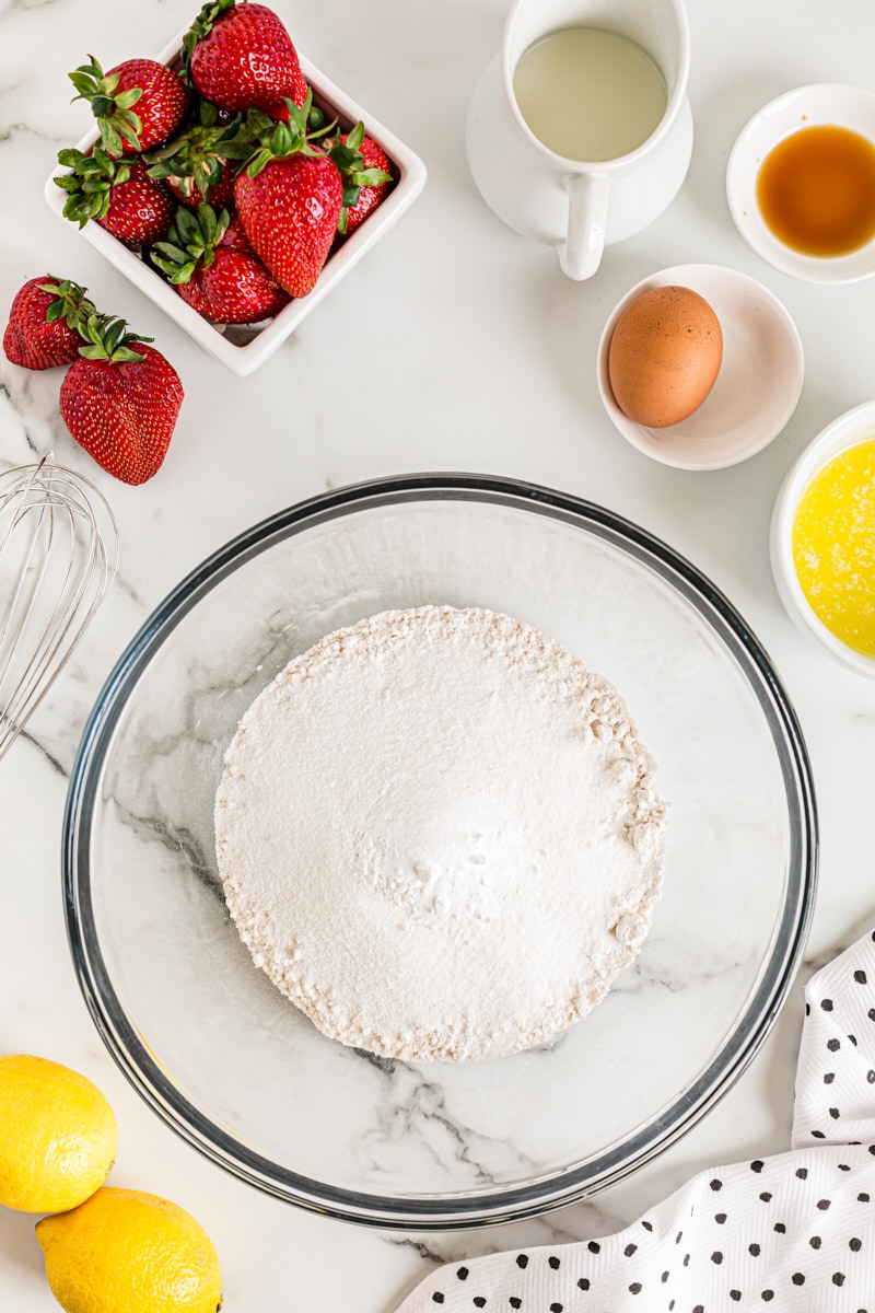 Overhead view of dry cake ingredients in mixing bowl