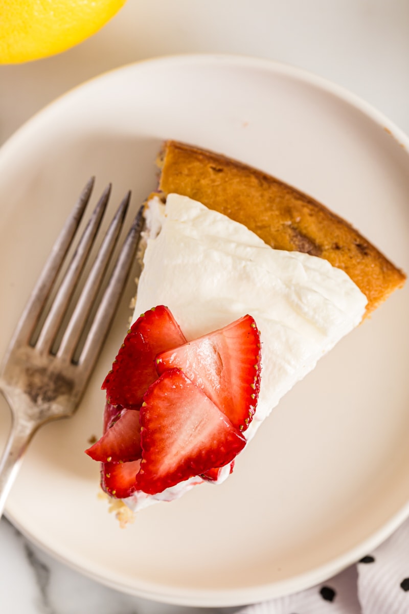 Overhead view of Lemon-Strawberry Shortcake on plate with fork