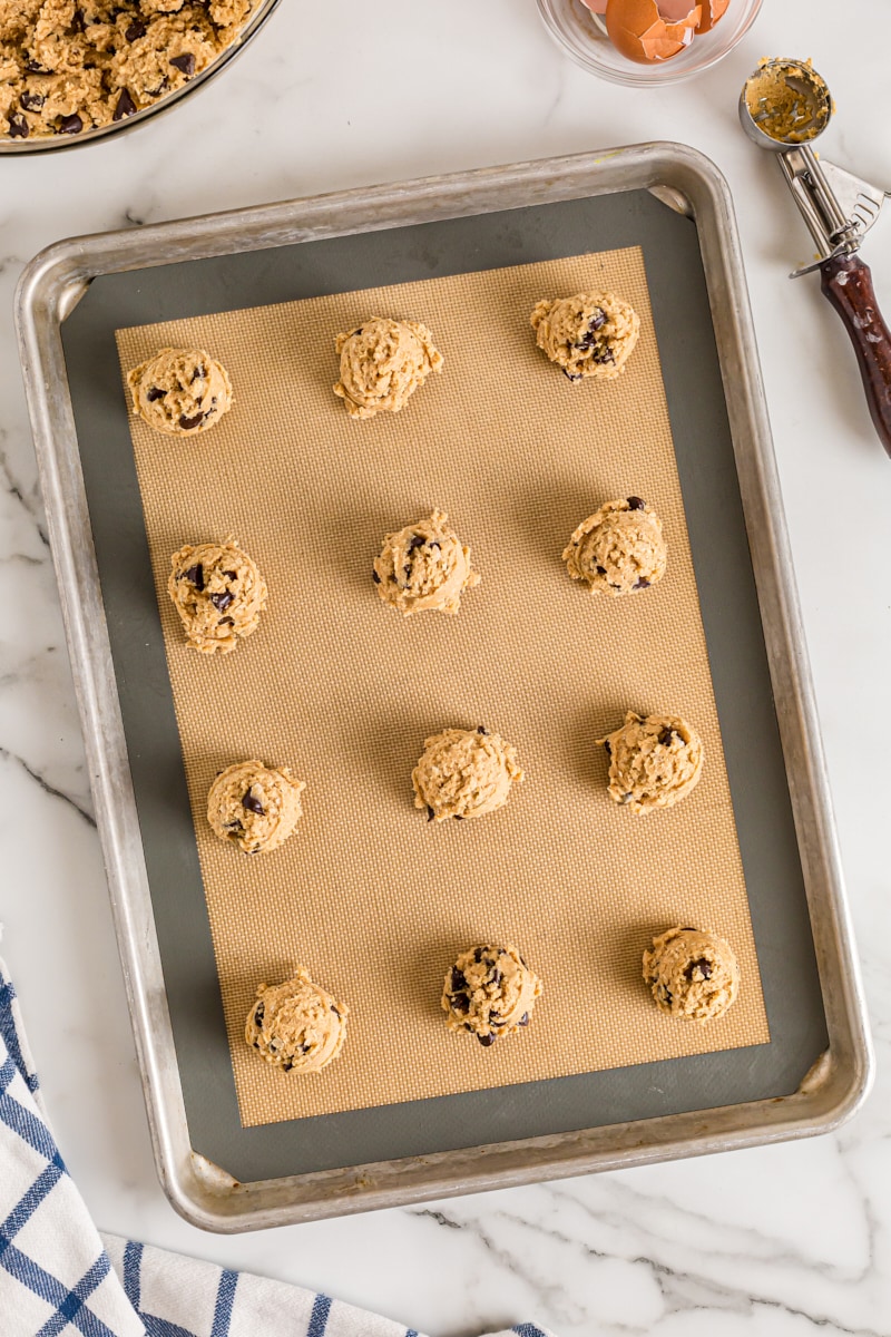 Overhead view of Oatmeal Peanut Butter Chocolate Chip Cookies on baking sheet before baking