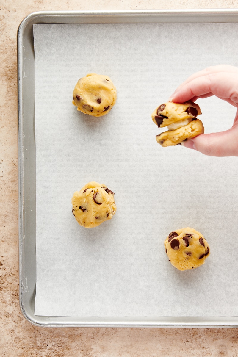 overhead view of partially assembled Cheesecake-Stuffed Chocolate Chip Cookies