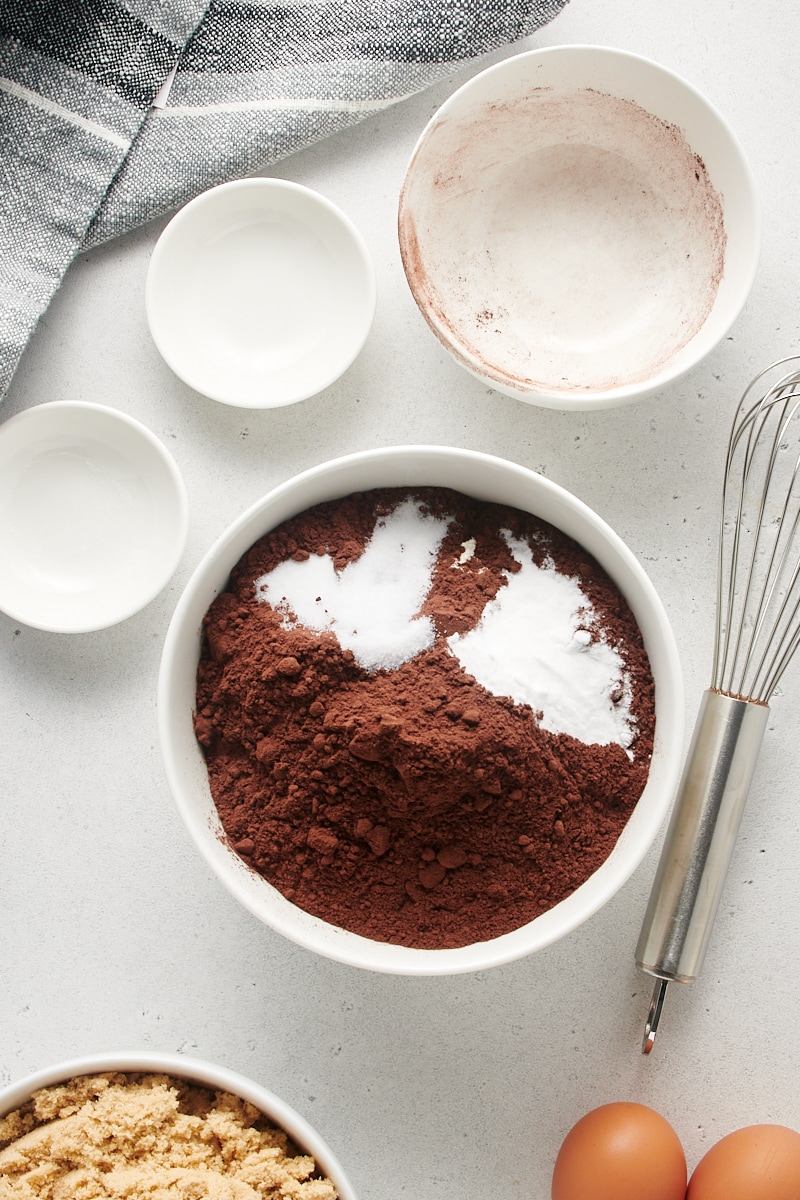 Overhead view of dry cake ingredients in mixing bowl, before whisking