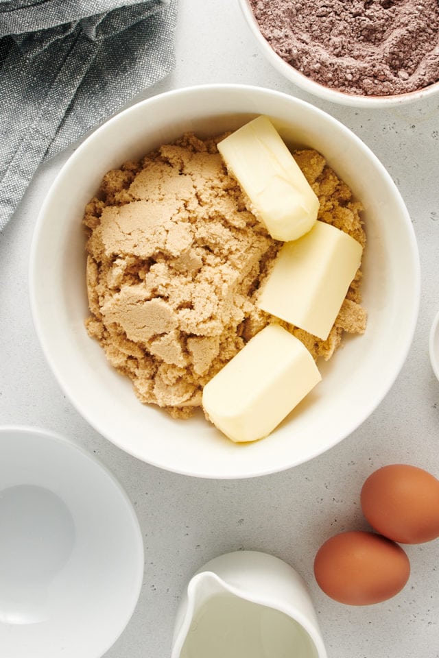 Overhead view of butter and sugar in bowl before mixing