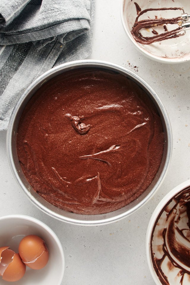 Chocolate cake batter in round pan