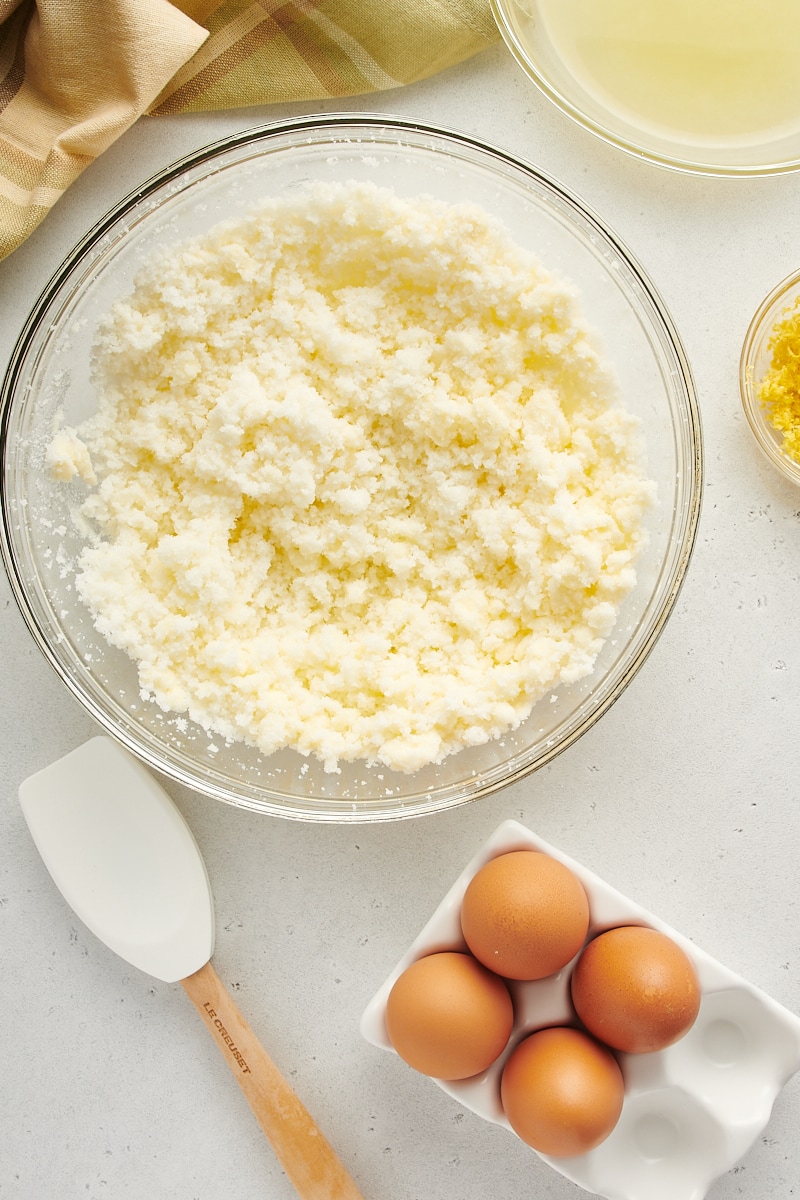 overhead view of butter and sugar mixed in a glass mixing bowl