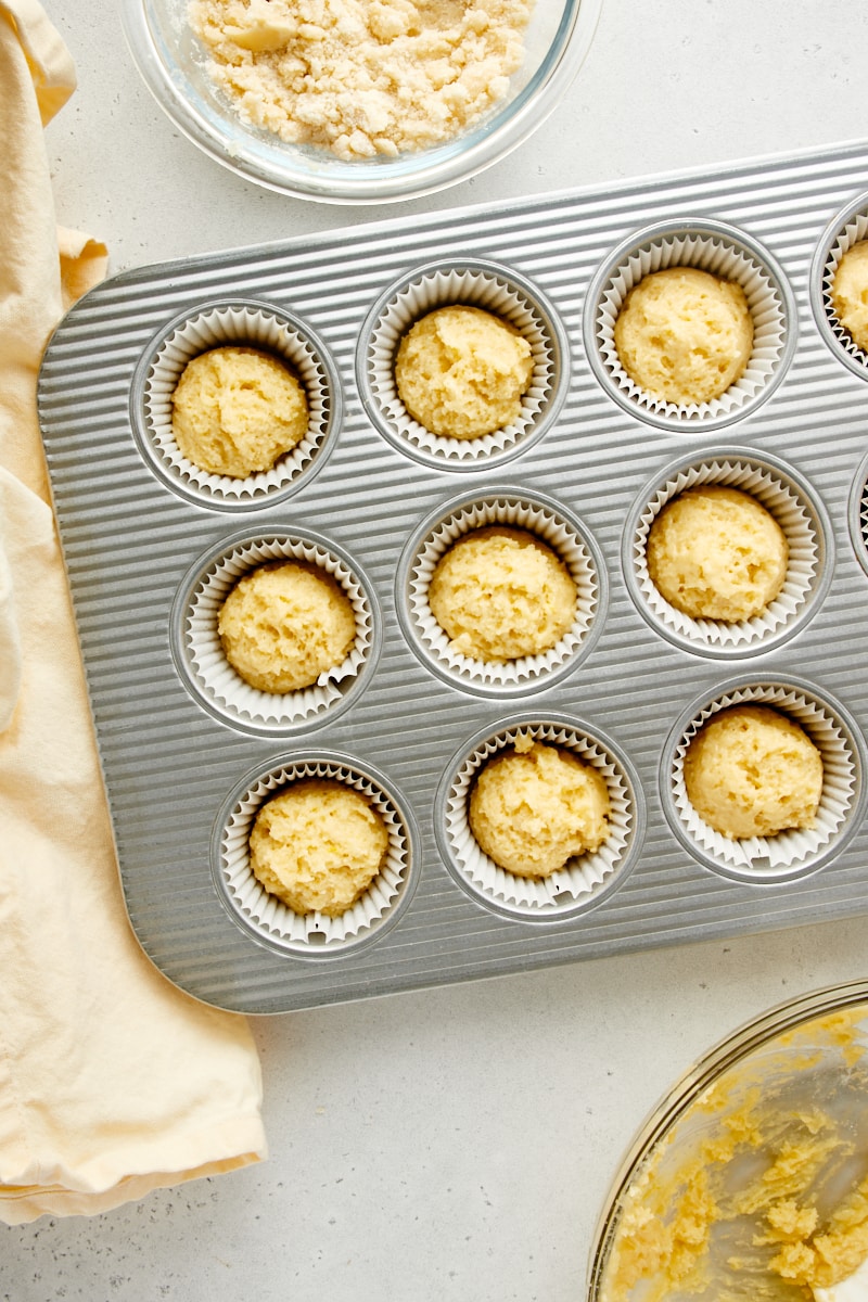 overhead view of lemon muffin batter in a muffin pan