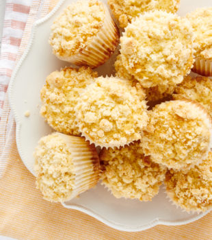 overhead view of Lemon Crumb Muffins piled on a white plate