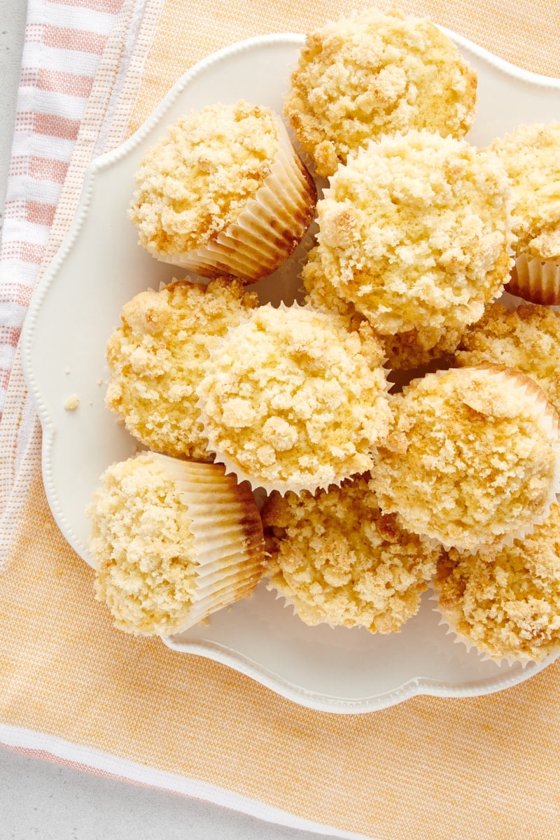 overhead view of Lemon Crumb Muffins piled on a white plate