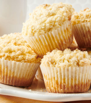 pile of Lemon Crumb Muffins on a white plate