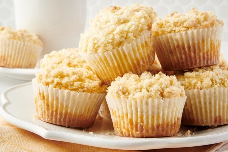 pile of Lemon Crumb Muffins on a white plate