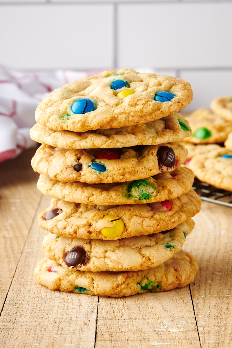 Tall stack of M&M cookies on table