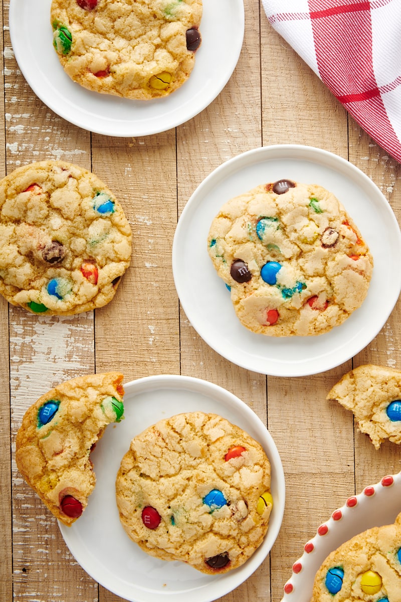 Overhead view of big M&M cookies on plates and table