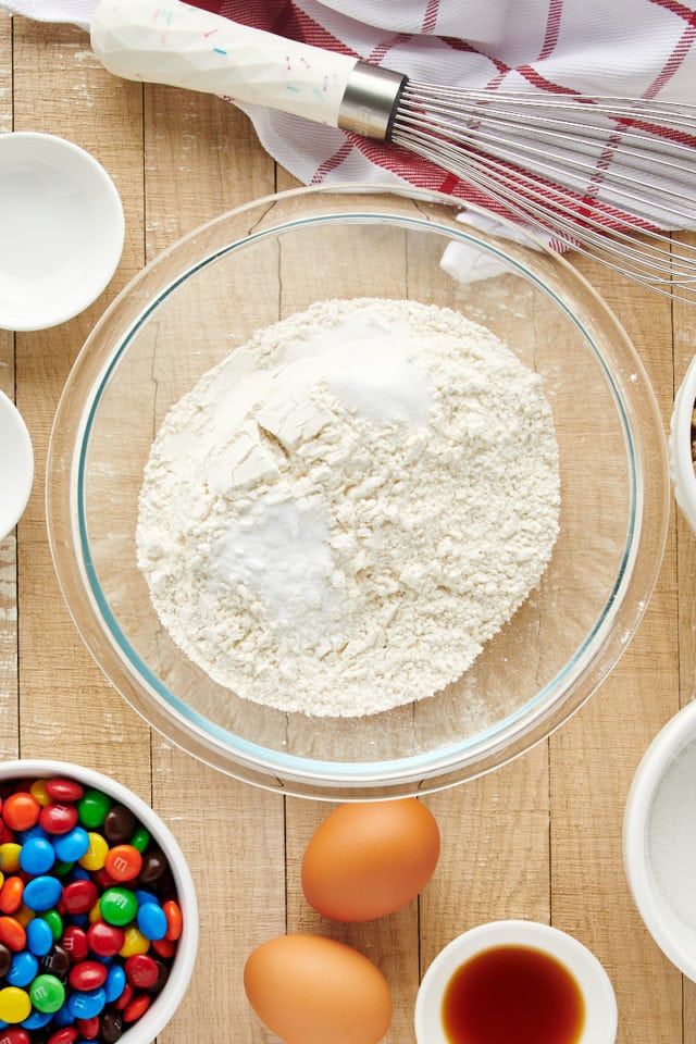 Overhead view of dry ingredients in glass bowl