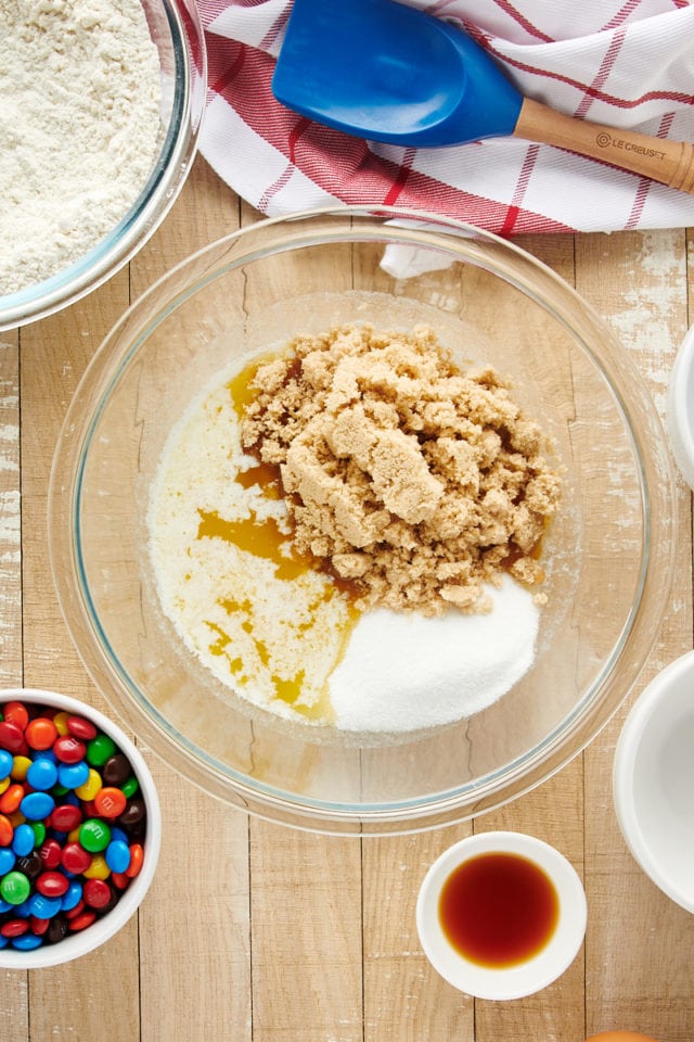 Butter, white sugar, and brown sugar in glass mixing bowl