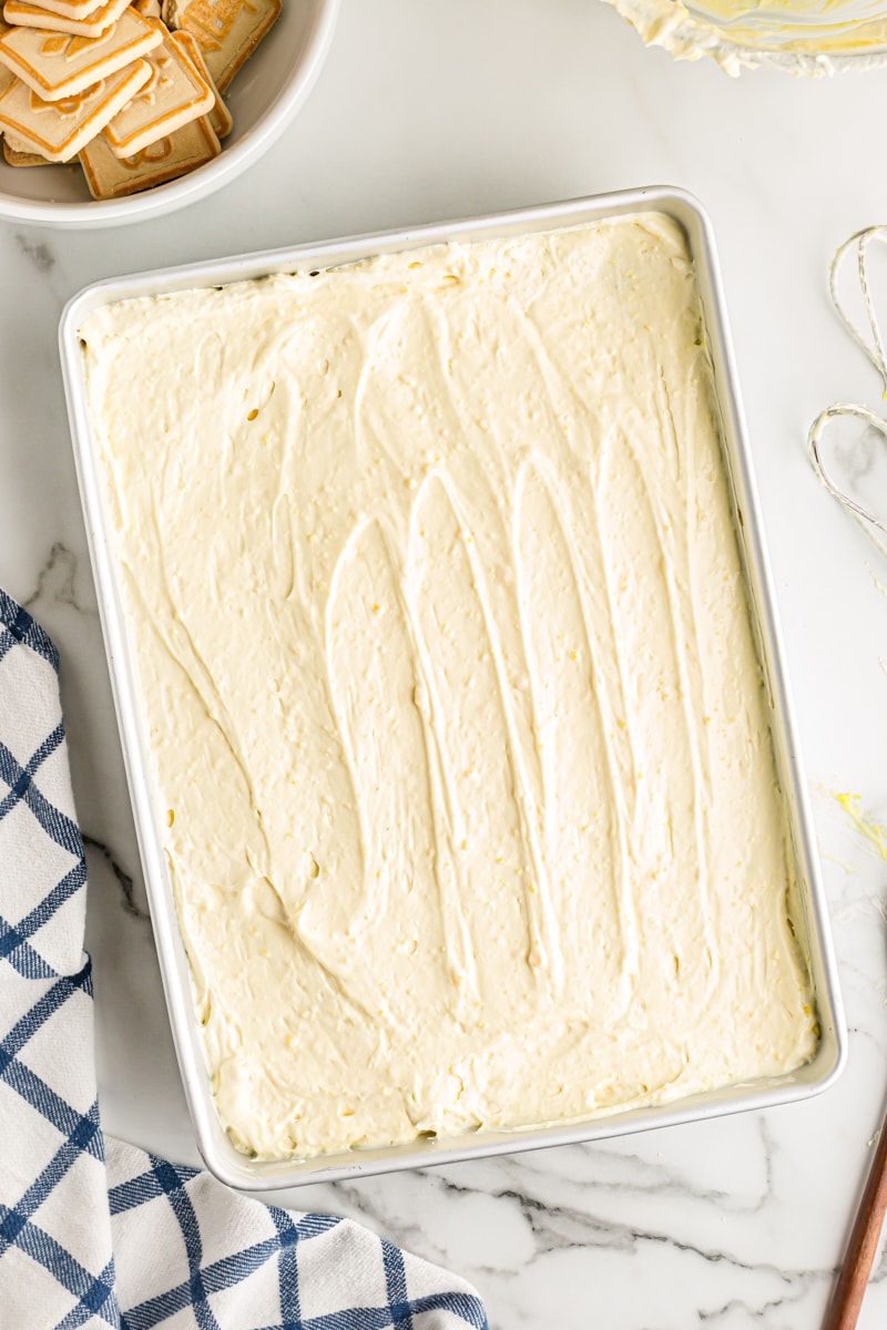 Overhead view of banana pudding mixture layer in pan