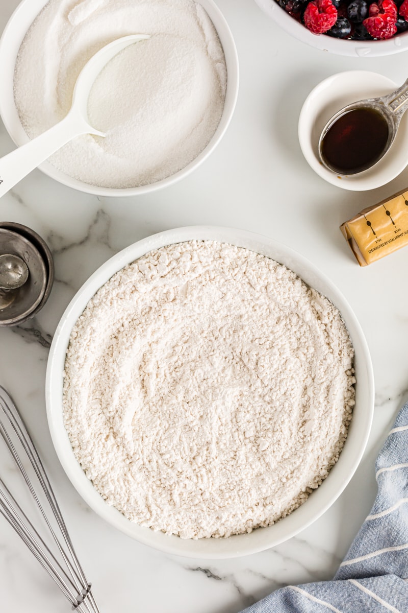 Overhead view of dry cake ingredients in mixing bowl