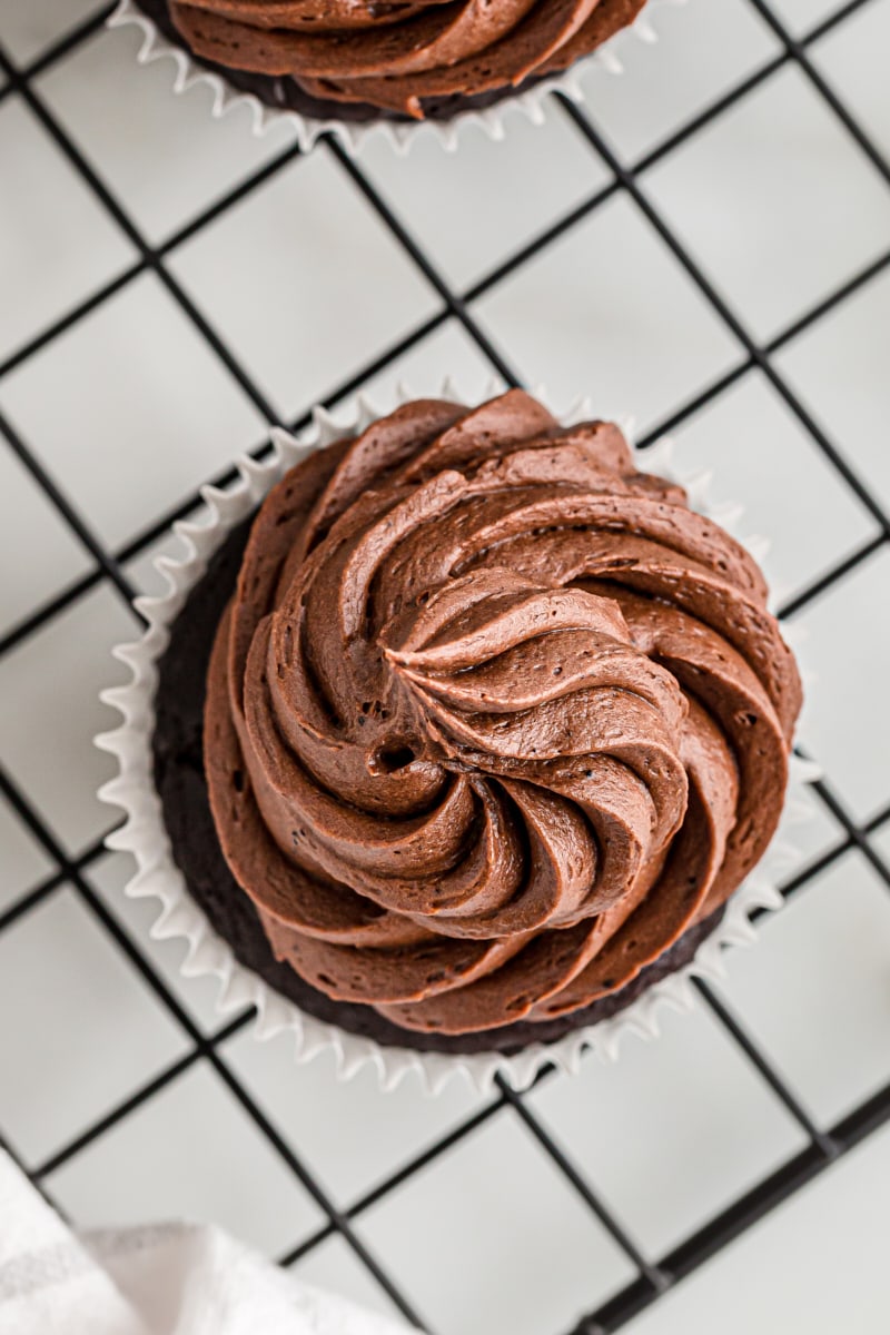 overhead view of a chocolate cupcake topped with chocolate buttercream