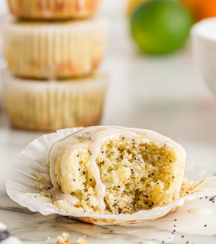 Triple citrus poppy seed muffin with bite taken out