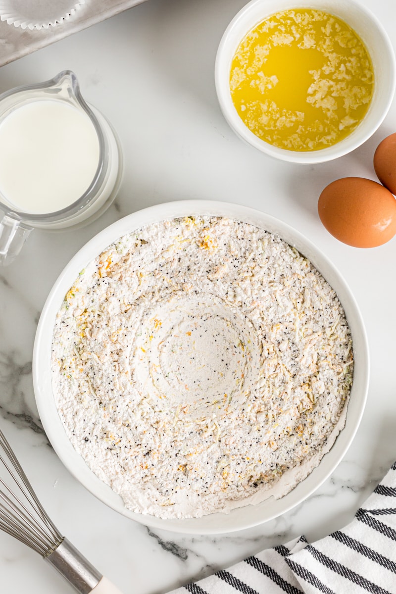 Overhead view of dry muffin ingredients in mixing bowl