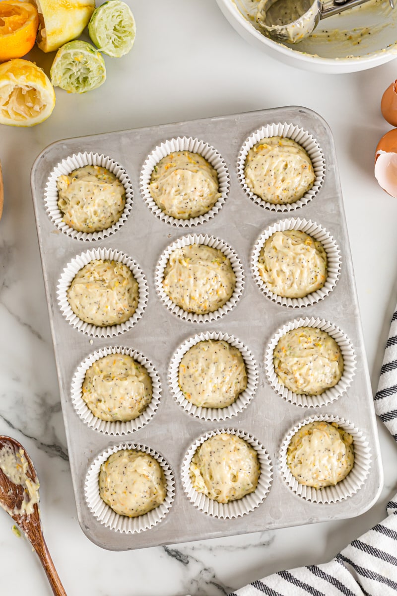 Overhead view of unbaked muffins in muffin tin