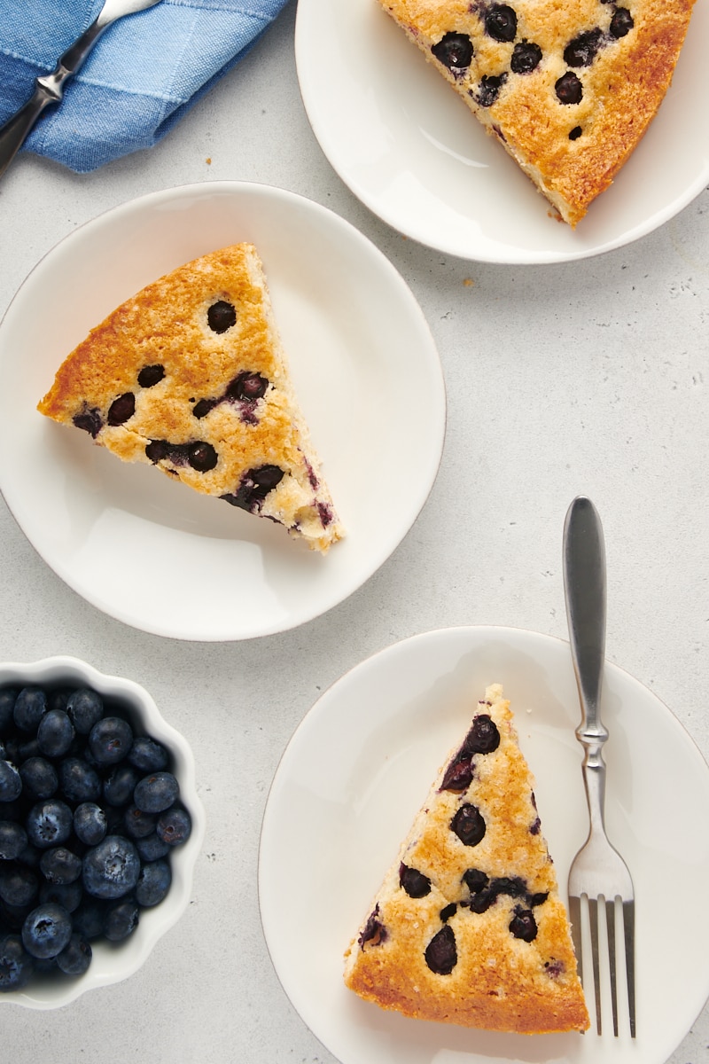 Overhead view of blueberry cake slices on plates