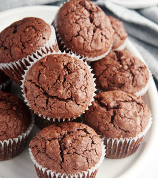 Brownie cupcakes stacked on plate