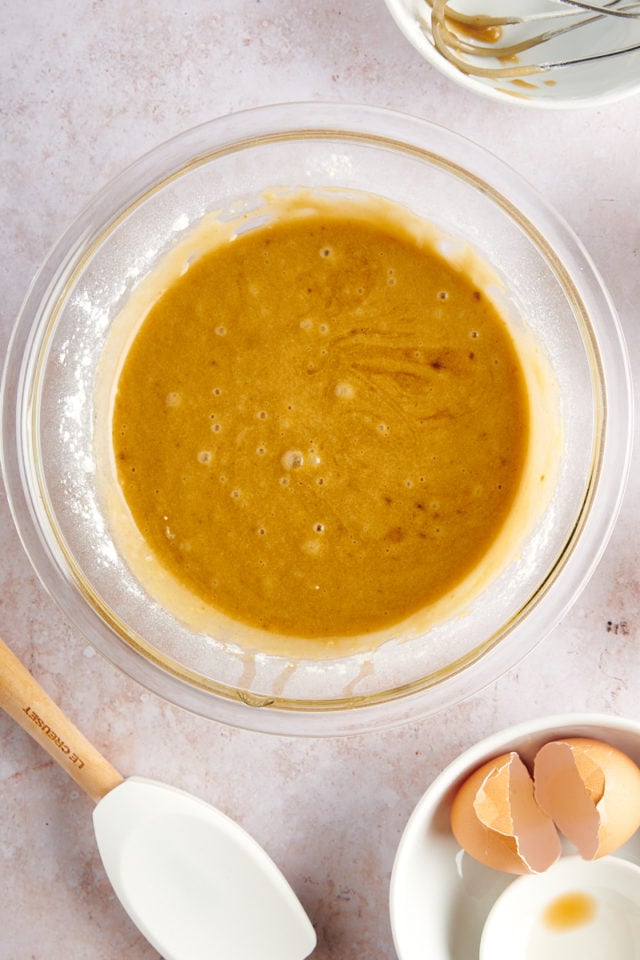 overhead view of mixed blondie batter in a glass mixing bowl