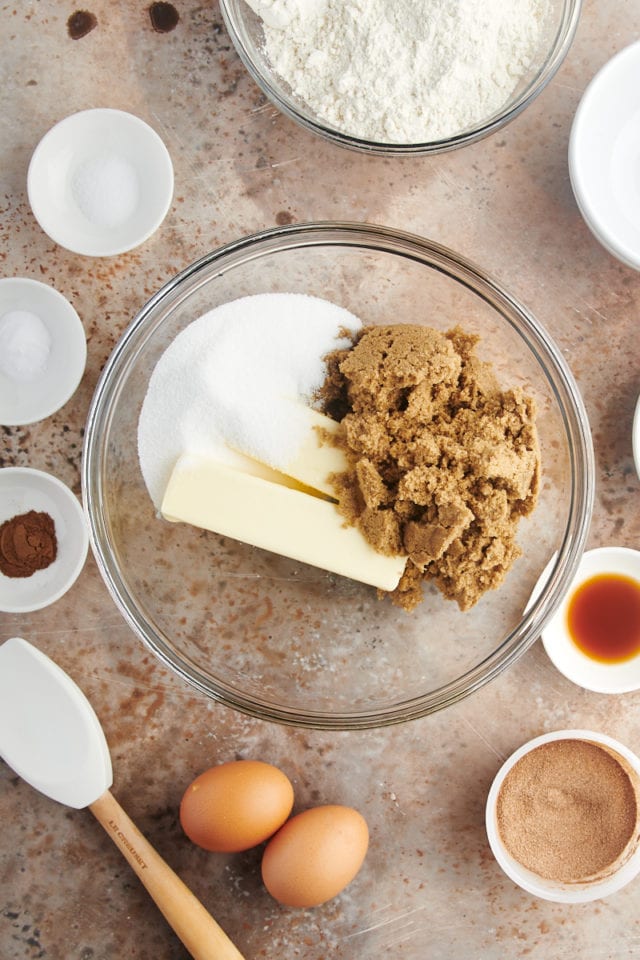 Overhead view of brown sugar, white sugar, and butter in mixing bowl