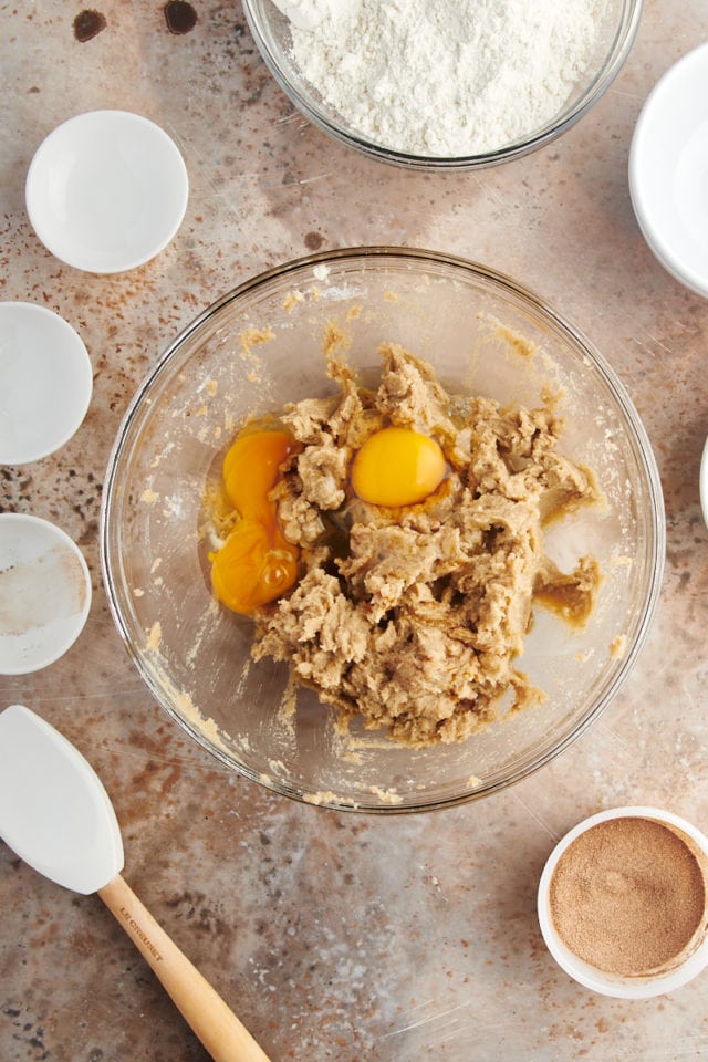 Adding eggs to snickerdoodle bar dough