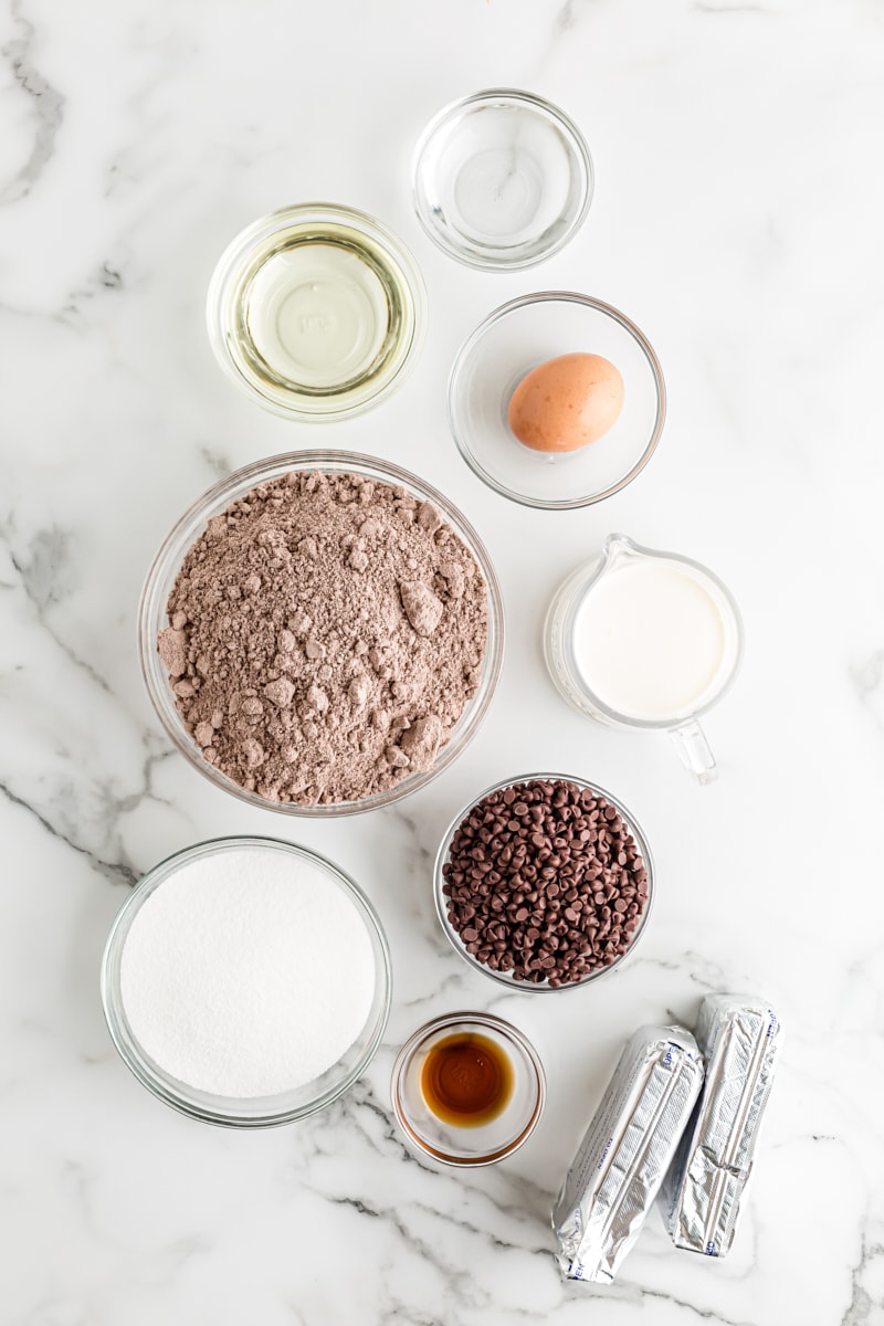 Overhead view of ingredients for Chocolate Chip Cheesecake with Brownie Crust