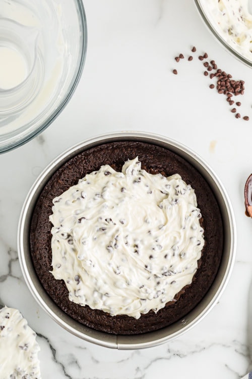 Cheesecake mixture on top of brownie crust, before spreading