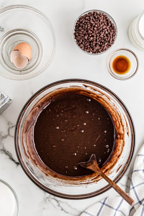 Brownie batter in glass mixing bowl