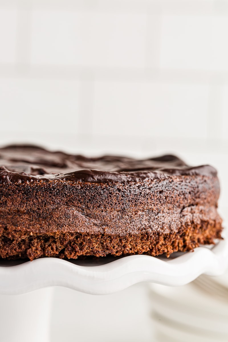 Closeup of flourless chocolate cake on cake stand