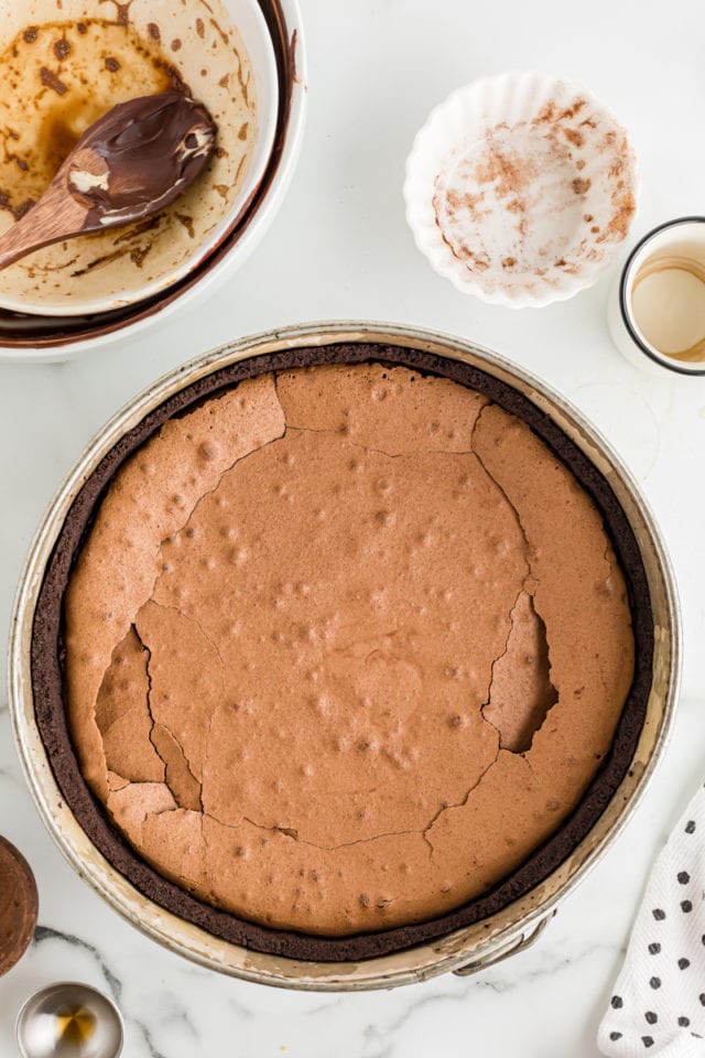 Overhead view of flourless cake layer in pan