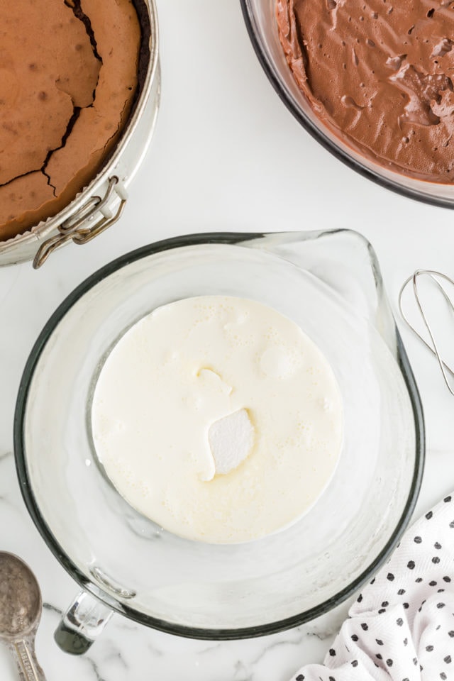 Overhead view of whipped cream ingredients in bowl