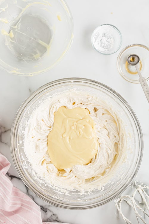 White chocolate frosting ingredients in mixing bowl