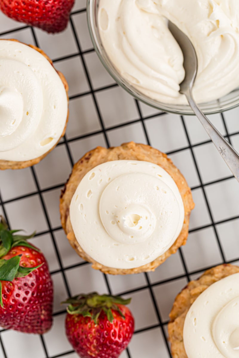 Overhead view of strawberry cupcakes on cooling rack