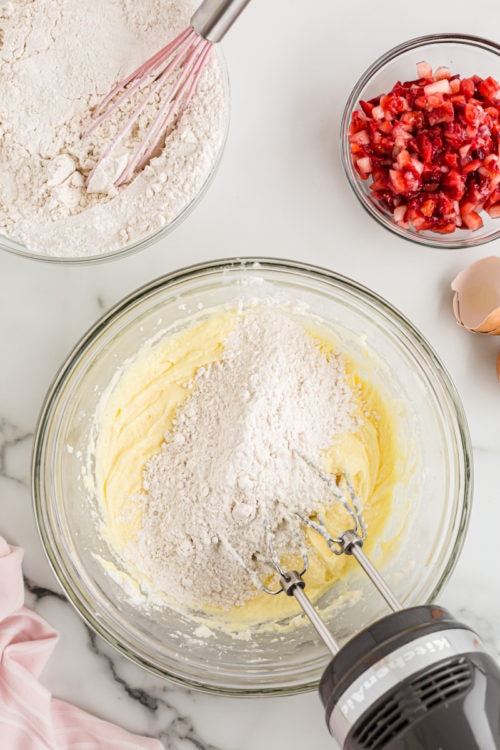 Beating flour into cupcake batter