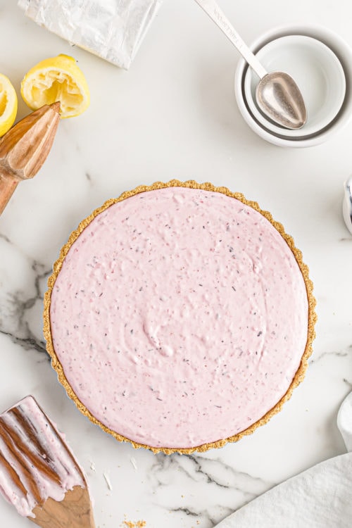 Triple berry no-bake cheesecake before chilling