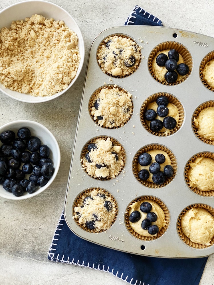 overhead view of Blueberry Coffee Cake Muffins being assembled for baking
