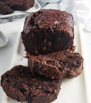 partially sliced Chocolate Zucchini Bread on a white tray