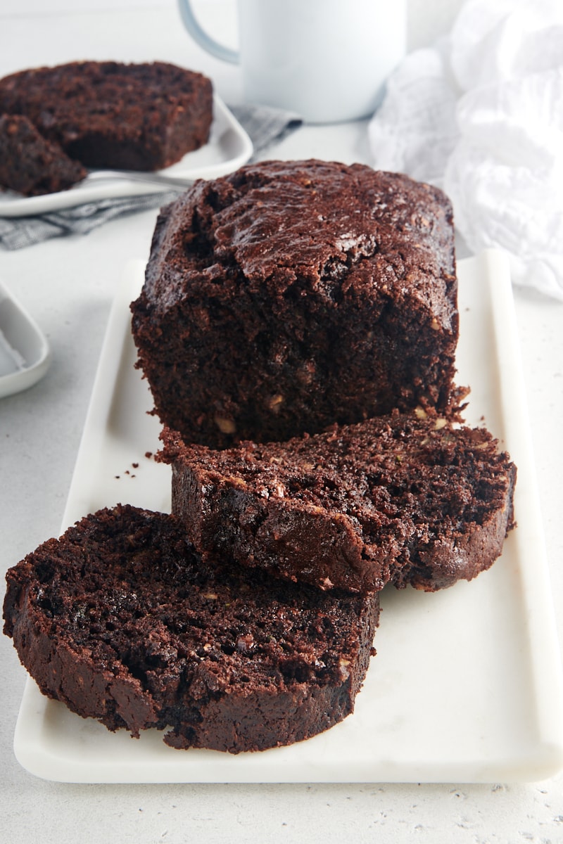 partially sliced Chocolate Zucchini Bread on a white tray