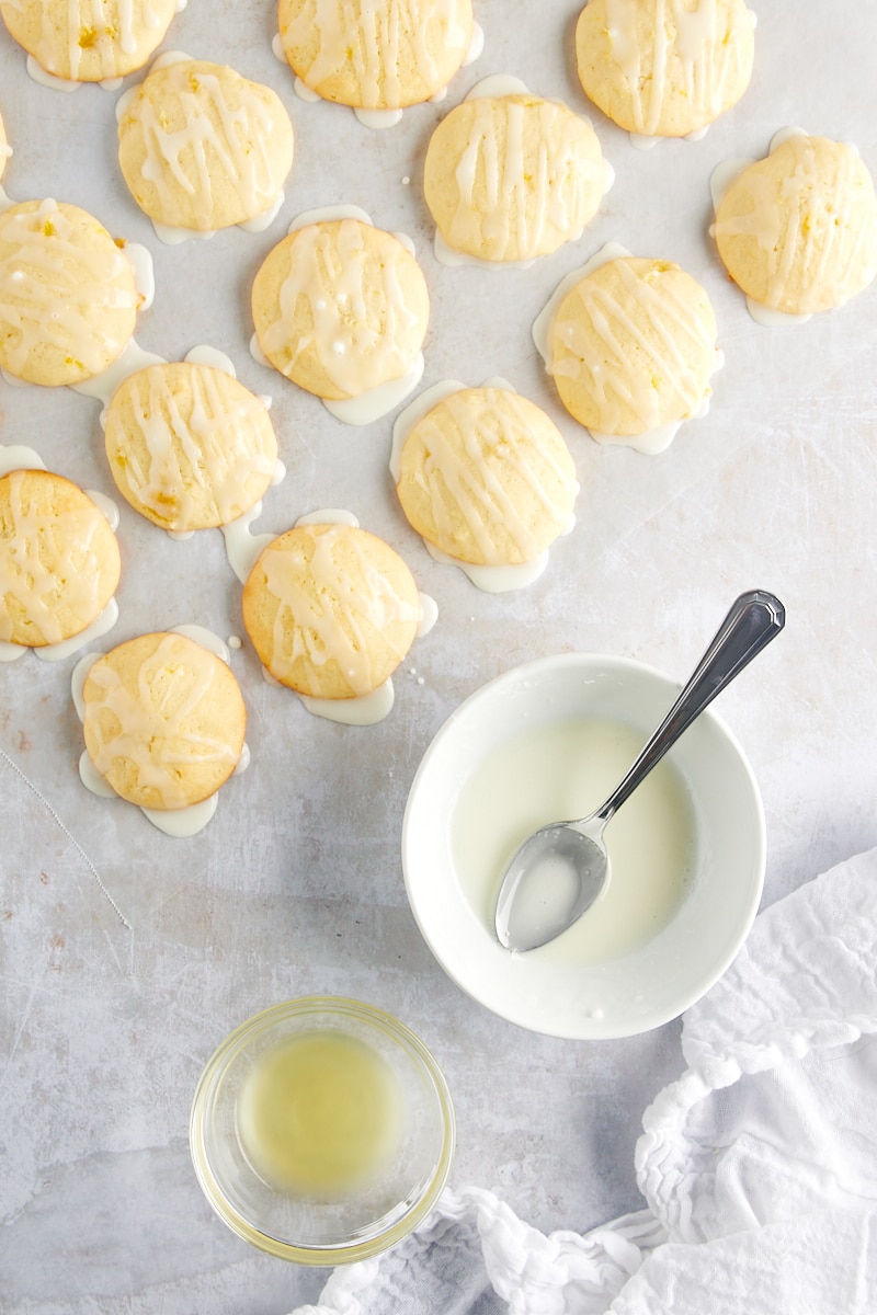 overhead view of Pineapple Cream Cheese Cookies being glazed